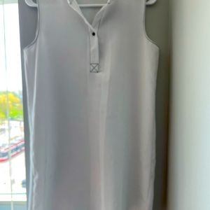 Nice shirt dress casual- sleeveless and white in colour.